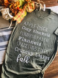 Share what you love about fall with this fall favorites shirt! Autumn Shirt Ideas, Autumn Tshirt Designs, Fall Coffee Shirts, Fall T-shirt, Cozy Short Sleeve Tops For Fall, Diy Fall Shirts Vinyl, Trendy Green T-shirt For Fall, Green Everyday Tops For Fall, Everyday Green Tops For Fall