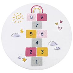 the children's play mat has numbers on it and rainbows in the sky