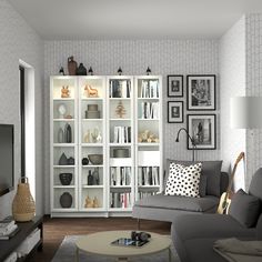 a living room filled with furniture and lots of books