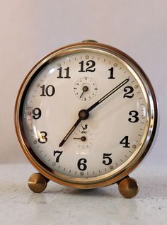 an alarm clock sitting on top of a table