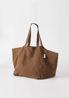 Now available for Pre-Order. Shipping mid-November. Your go-to carry-all bag. Designed for beach days, market trips and weekends away. Made from 100% soft linen in the perfect size to fit all your daily essentials. Cotton Weekender Bag For Everyday Summer Use, Summer Cotton Weekender Bag For Everyday, Travel Bags With Pockets In Natural Color, Casual Linen Canvas Bag For Travel, Casual Natural Linen Canvas Bag, Casual Brown Linen Bag, Summer Beach Bag With Pockets For Everyday, Eco-friendly Linen Shoulder Bag For Beach, Eco-friendly Linen Canvas Bag For Beach