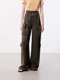 MO&Co. Women's Wide Leg Cargo Pants These pants are made from sustainable and eco-friendly materials, featuring a wide-leg and cargo style making them a fashionable and practical choice for a casual or streetwear look. The wide pocket design adds functionality and versatility, perfect for carrying essentials while on the go, and the belt ensures a secure fit and adds an extra touch of style. The brown pants may appear olive or khaki under different lighting. Features : - Wide leg in cargo style, Khaki High-waisted Cargo Parachute Pants, Khaki High Waist Cargo Parachute Pants, Khaki High Waist Utility Parachute Pants, Workwear Parachute Pants With Multiple Pockets, Wide Leg Parachute Pants With Multiple Pockets For Work, Utility Wide-leg Pants With Multiple Pockets, Loosely Fitted Wide-leg Utility Parachute Pants, High-waisted Parachute Pants With Multiple Pockets, Summer Full-length Cargo Pants With Multiple Pockets