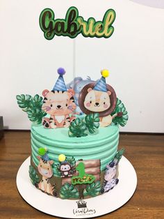 a cake decorated with animals and jungle decorations