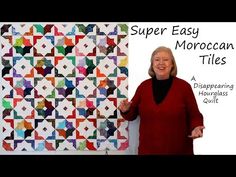 a woman standing in front of a quilt with the words super easy moroccan tiles on it