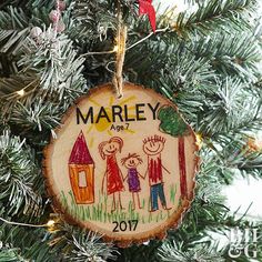 a wooden ornament hanging from a christmas tree