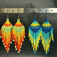 Traditional Mexican Handmade Huichol chaquira (beaded) earrings made by Mexican artisans in the Mexican state of Chipas. The earrings are lightweight, colorful and sure to bring you lots of compliments. Earrings Patterns, Traditional Mexican, Multi Colored, Beaded Earrings, Favorite Jewelry, Jewelry Earrings Dangle, Etsy Earrings, Dangle Drop Earrings, Dangle Earrings