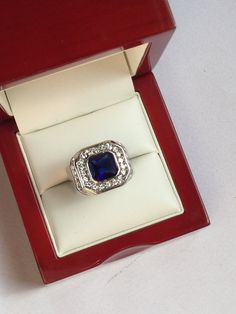 Antiques Art Deco Style Silver Blue Sapphire Glass Ring Un grande anello essenziale ed elegante. Argento, un grande zaffiro blu in vetro e tanti piccoli strass. Condizioni come da foto Accessori non compresi Elegant Sapphire Crystal Ring For Formal Occasions, Classic Sapphire Crystal Ring For Formal Occasions, Sapphire Crystal Diamond Ring For Formal Occasions, Classic Formal Sapphire Crystal Ring, Formal Sapphire Crystal Ring With Diamond, Modern Blue Sapphire Ring For Formal Occasions, Formal Sapphire Crystal Ring, Modern Blue Sapphire Jewelry, Formal Sapphire Crystal Ring With Accent Stones