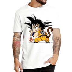 Embrace the adorable side of Dragon Ball Z with our Cute Kid Goku Yellow Clothing T-Shirt! This delightful t-shirt brings back the innocence and charm of Goku's early days, capturing his lovable spirit in a charming and endearing design. At the heart of this t-shirt is Kid Goku, the young Saiyan who embarked on countless adventures and captured the hearts of fans worldwide. The design showcases Goku in his classic yellow outfit, a symbol of his pure-hearted and optimistic nature. With his wide s White Anime T-shirt With Letter Print, White Anime T-shirt With Sublimation Print, Kawaii T-shirt With Cartoon Print For Fans, Kawaii Cartoon Print T-shirt For Fans, Kawaii T-shirt With Character Print For Fans, White Pre-shrunk Fandom T-shirt, Funny White T-shirt With Character Print, White Crew Neck T-shirt With Cartoon Print, White Short Sleeve Pop Culture Top