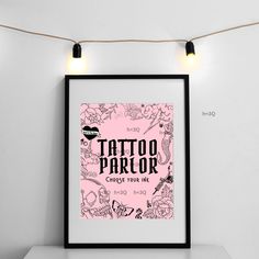 a pink poster with the words tattoo parlor on it in front of a white wall