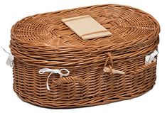 an empty wicker basket with white tags on the lid and handles is shown in front of a white background