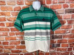 "90s Izod striped polo. Lightly used no major issues MEASURES -  23\" pit to pit and 26.5\" long in front, 29\" long in back TAGGED - ~ BE SURE TO CHECK OUT MY ENTIRE SHOP ~ - This is a TRUE VINTAGE item! Vintage clothing sizing varies wildly ALWAYS use the measurements and info provided in the listing to assure proper fit! Unless the words \"deadstock\" or \"unworn\" are used please understand this is a USED item. RETURNS - My policy is NO RETURNS but I will make an exception if you agree to cover the return shipping as well as forfeit the shipping I paid to ship the item. If I made an error I will make it right 100% but I am not responsible if you change your mind/\"item does not fit\". Please use the measurements provided if you don't know how ask me I will gladly help you :) ** Why buy Green Polo Shirt With Striped Collar And Short Sleeves, Green Short Sleeve Polo Shirt With Striped Collar, Green Collared T-shirt For Streetwear, Green Short Sleeve Polo Shirt For Streetwear, Casual Green Polo Shirt For Streetwear, Green Cotton Polo Shirt For Streetwear, Retro Green Short Sleeve Polo Shirt, Vintage Green Short Sleeve Polo Shirt, Vintage Green Cotton Polo Shirt