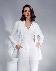 Three-piece pantsuit for women: straight leg pants with high rise, buttoned vest and lined blazer Please note suit measurements  Pants length inseam is 36 inches or 91 cm Sleeve length 24 inches or 61 cm Our Women's Blazer Trouser Suit for office, business meetings, formal events and special occasions. Always trendy, classic and o good looking DETAILS -  straight leg pants -  high rise -  blazer is buttoned -  lined -  side pockets -  relaxed fit -  single breasted -  buttoned vest MATERIAL Premium quality suiting fabric, consists of viscose, elastane and polyester  SIZES The model in photos is wearing a size S Available in 4 sizes: 2 US numeric  BUST 32-34 inches or 82-86 cm WAIST 23-24.8 inches or 59-63 cm HIPS 33-35 inches or 86-90 cm 4 US numeric  BUST 34-35 inches or 86-90 cm WAIST 25 Wedding Suit Women, Wedding Suits For Bride, Bridal Pantsuit, Formal Pant Suits, White Pantsuit, Suit Measurements, Suiting Fabric, Woman Suit Fashion, Pantsuits For Women