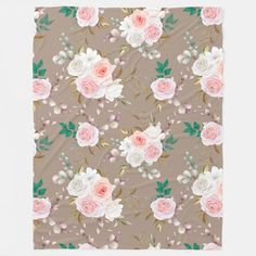 a blanket with pink and white roses on it, in front of a gray background