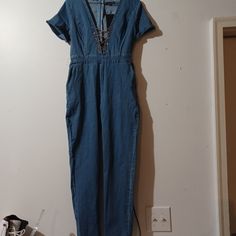 Fashion Nova Denim Blue Womens Jumpsuit With Gold Chain Zipper In Back New With Tag Size Large Blue Denim Jumpsuits And Rompers For Night Out, Blue Denim Jumpsuits For Night Out, Casual Denim Blue Jumpsuit For Night Out, Trendy Denim V-neck Jumpsuits And Rompers, Casual High Rise Denim Jumpsuit For Night Out, Casual Dark Wash Denim Jumpsuit For Night Out, Trendy Blue Denim Jumpsuit With V-neck, Trendy Blue V-neck Denim Jumpsuit, Womens Denim Jumpsuit