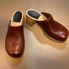 Never Worn! Brown Swedish Hasbeens Clogs. Purchased From Their Store In Sweden. Heel Is 2 1/2 Inches-But Does Not Feel Like It! I Am A Size 8.5 And The 39 Fits Perfectly. Smoke Free/Pet Free Home I Send Out Within One Day. Classic High Heel Leather Clogs, Medium Width Slip-on Mules With Heel Loop, Leather Clogs With Wooden Heel And Almond Toe, High Heel Clogs With Leather Sole, Classic Mules With Reinforced Heel And Round Toe, Classic Leather Clogs Medium Width, Classic High Heel Clogs With Leather Sole, Wooden Heel Clogs With Medium Width And Round Toe, Medium Width Slip-on Clogs With Reinforced Heel