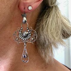 A delicate and whimsical design for these fillagree silver earrings. Classic motifs with Mexican hand and bird milagros. Layers of fillagree swirls, flowers, and hand engraved detail end with an amethyst drop.  A lightweight lacy statement chandelier earring! Metal - sterling silver marked 925 with makers mark MG - 44, they were made in Mexico City Gem - Amethyst Earrings are 70mm or 2 3/4 inch long from top of hook to bottom of drop, and 32mm, at widest point *The pictures are part of the descr Statement Chandelier, Chandelier Earring, Statement Chandeliers, Earrings Classic, Whimsical Design, Coral Beads, Amethyst Earrings, Dublin Ireland, Postal Service