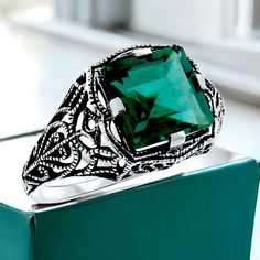 Discover the timeless beauty of our Vintage 3.50 Carat Simulated Emerald Ring, a stunning piece that effortlessly captures the essence of antique elegance with its intricate filigree design crafted in 925 solid sterling silver. This exquisite ring not only showcases a rich green hue reminiscent of May's birthstone, but it also evokes a sense of nostalgia and charm that makes it a perfect anniversary present or a meaningful gift for a loved one. Feel the allure of vintage sophistication and let the sparkle of this ring illuminate your style--make it yours today and bring a piece of history into your jewelry collection! Excellent Condition/Like New. Elegant Engraved Emerald Jewelry, Classic Emerald Ring For Anniversary, Formal Emerald Ring With Intricate Design, Vintage Engraved Emerald Ring For Anniversary, Antique May Birthstone Jewelry For Formal Occasions, Classic Filigree Ring With Emerald Cut For Formal Occasions, Formal Emerald Jewelry With Filigree Detail, Vintage Emerald Ring With Intricate Design For Anniversary, Classic Sterling Silver Emerald Promise Ring