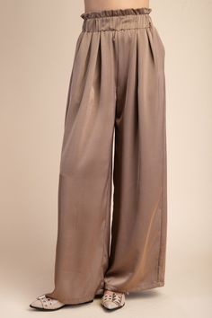 High waist, elastic waistband wide leg pants with side slit pockets. No stretch woven fabric with a sheen. Polyester. Paired with Trainor Surplice Blouse. Baseball Hat Hairstyles, Surplice Blouse, Short Jean Skirt, Short Stack, Loose Pants, New Arrival Dress, Toledo, Hat Hairstyles, Bottoms Pants