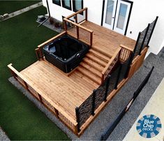 a hot tub sitting on top of a wooden deck