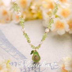 Pearl Avocado Necklace; summer jewelry; fruit necklace; trending now Beaded Avocado, Avocado Necklace, Golden Necklace, The Pearl, Playful Design, Pearl Beads, Unique Pieces, Timeless Elegance, Natural Beauty