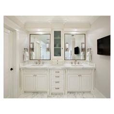 a large bathroom with double sinks and two mirrors on the wall next to each other