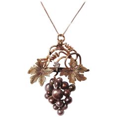 A "Park Avenue Couture" Creation. We converted an Early Victorian Grape Leaf brooch into to a fabulous pendant. This has a mine cut diamond approximately 10 points set between the 2 green gold leaves. Black pearls make up the grapes. The pendant measures 1.47 in. x 1.19 in. The chain is 17.25 in. long end to end. The chain is contemporary. This is out of a massive collection of Contemporary designer & Vintage clothing as well as Hopi, Zuni, Navajo, Southwestern, sterling silver, costume jewelry, Victorian Pendant Necklace, Silver Costume, Victorian Pendants, Black Pearls, 10 Points, Grape Leaf, Rose Green, Snake Pendant, Cameo Jewelry