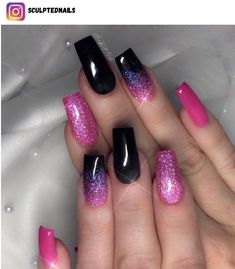 a woman's hand with pink and black nail polishes on her nails,