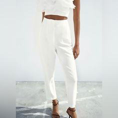 Zara High-Waisted Pants Saize Xs Color White High Waisted Pants With Pronounced Seams At Front And Back. Front Welt Pockets. Front Zip, Metal Hook, And Inside Button Closure. 7102/562 Fitted White Bottoms With Elastic Waistband, White Fitted Tapered Leg Pants, Fitted White Tapered Leg Pants, White Fitted Trousers Pantsuit, Stretch High Waist Pantsuit For Spring, White Fitted Pantsuit, Spring High Waist Pantsuit For Night Out, Fitted White Ankle-length Pants, White Fitted Ankle-length Pants