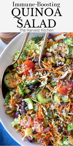 a salad with carrots, broccoli and cucumber in it on a white plate