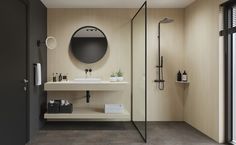 a bathroom with a sink, mirror and shower stall in it's center area