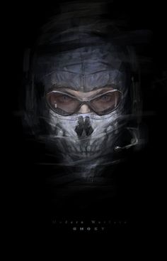 a man wearing a hood and goggles with a skull on his face in the dark