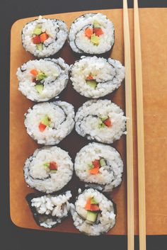 sushi with chopsticks in a wooden box