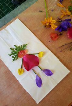 paper flowers are laid out on a table