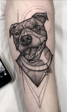 a black and white photo of a dog's face on the arm with geometric shapes