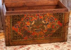 an old wooden box with decorative designs on it