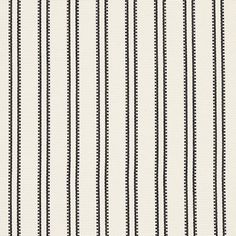 a black and white striped fabric with small dots on the bottom, along with vertical lines