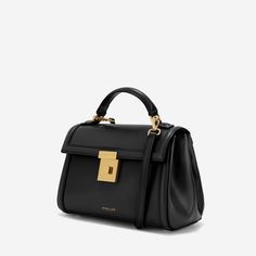 Timeless Top Handle Flap Bag, Timeless Luxury Satchel With Top Carry Handle, Elegant Satchel With Round Handle For Work, Elegant Workwear Satchel With Round Handle, High-end Everyday Top Handle Box Bag, Everyday Luxury Top Handle Box Bag, Timeless Top Handle Satchel For Everyday Luxury, Elegant Shoulder Bag With Round Handle For Work, Timeless Formal Flap Bag With Top Handle