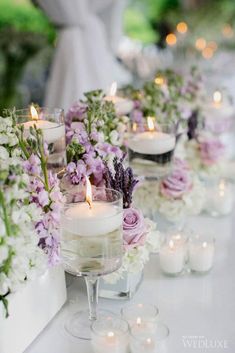 the table is set with candles and flowers