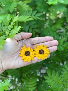 These sunflower earrings are bright and light. -Measure approximately 3.5 inches from top of hook to bottom of sunflower -Measure approximately 2.5 inches in width -Made with embroidery thread and are light on the ears -Lightweight -Free shipping -Made in Naples, FL Summer Flower Earrings With Sunflower Design, Summer Sunflower Design Flower Earrings, Summer Sunflower Design Earrings, Ray Bands, Fitbit Bands, Sunflower Earrings, All Band, Small Bracelets, Naples Fl