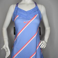 a female mannequin wearing a blue dress with red, white and blue stripes