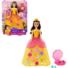 the princess doll is in its box next to it's packaging