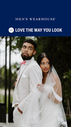 a man and woman standing next to each other in front of the words men's wearhouse love the way you look