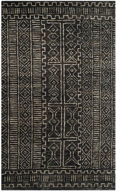 a black and white rug with an intricate design