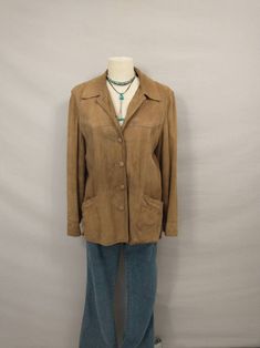 "Classic vintage lightly sueded leather jacket, comfortable casual style natural tan color. Quality construction and nice detail. Unique piece for casual wear or street wear. Front pockets. Fully lined inside. Condition is good, small spots no major stains, no rips or damage, lots of life left. Some minor shredding and spots on lining. Soft lightweight leather with light natural wear. No size marked - please go by measurements. Shown on a 6 mannequin. Label is Leathers by New England Sports wear Classic Beige Leather Jacket With Long Sleeves, Casual Suede Leather Jacket With Pockets, Casual Brown Suede Leather Jacket, Vintage Beige Leather Jacket With Long Sleeves, Vintage Beige Leather Jacket For Fall, Casual Suede Single Breasted Outerwear, Casual Single Breasted Suede Outerwear, Collared Suede Leather Jacket In Casual Style, Casual Suede Leather Jacket With Collar