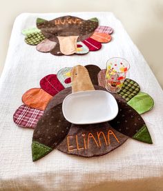 a table topped with a turkey shaped plate