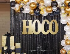 a black and gold birthday party with balloons