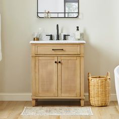 a bathroom with a sink, mirror and bathtub in the corner next to a rug