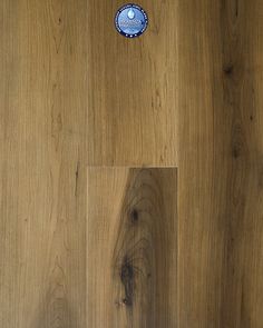 a wooden floor with a blue and white plate on it