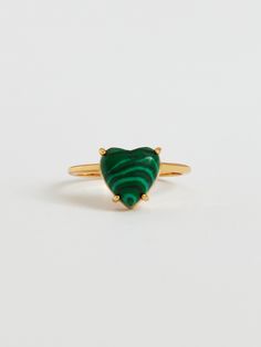 Editor's NotesThis charming viollina jewelry is ideal for adding a little luxury to add to any look.- Dome shaped heart prong setting point- Malachite gemstone used- Lovely and kitsch mood- Daily point itemMeasurements(in.)S / M / L- Small: 10- Medium: 13- Large: 16- Heart: 0.39 in.Composition & Care-  22K Gold Plating  Brass  Malachite- Avoid moisture and store in a zipper bagDesigner- by VIOLLINA Elegant Emerald Heart-shaped Ring, Elegant Green Heart Ring For Valentine's Day, Emerald Heart Charm Jewelry, Heart-shaped Emerald Jewelry For Valentine's Day, Valentine's Day Heart Shaped Emerald Jewelry, Luxury Heart Cut Gemstone Heart Ring, Luxury Heart Cut Gemstone Ring, Green Ring For Valentine's Day, Elegant Heart Ring With May Birthstone Gemstone