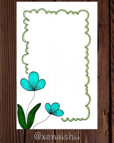 a card with blue flowers and green leaves